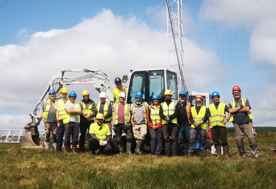 Dulas and Double K teams assembling tilt-up lattice mast